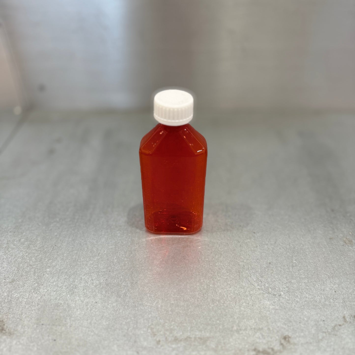 Medium Liquid Medicine Bottle with Cap - Amber - Closeup 