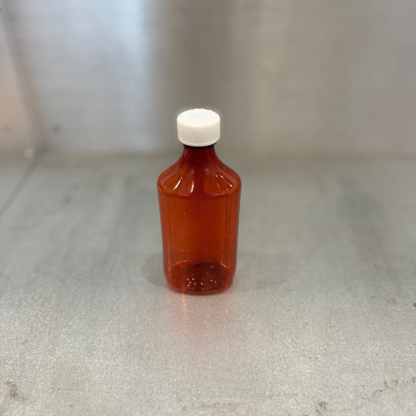 Medium Liquid Medicine Bottle with Cap - Amber - Closeup and Different Angle 